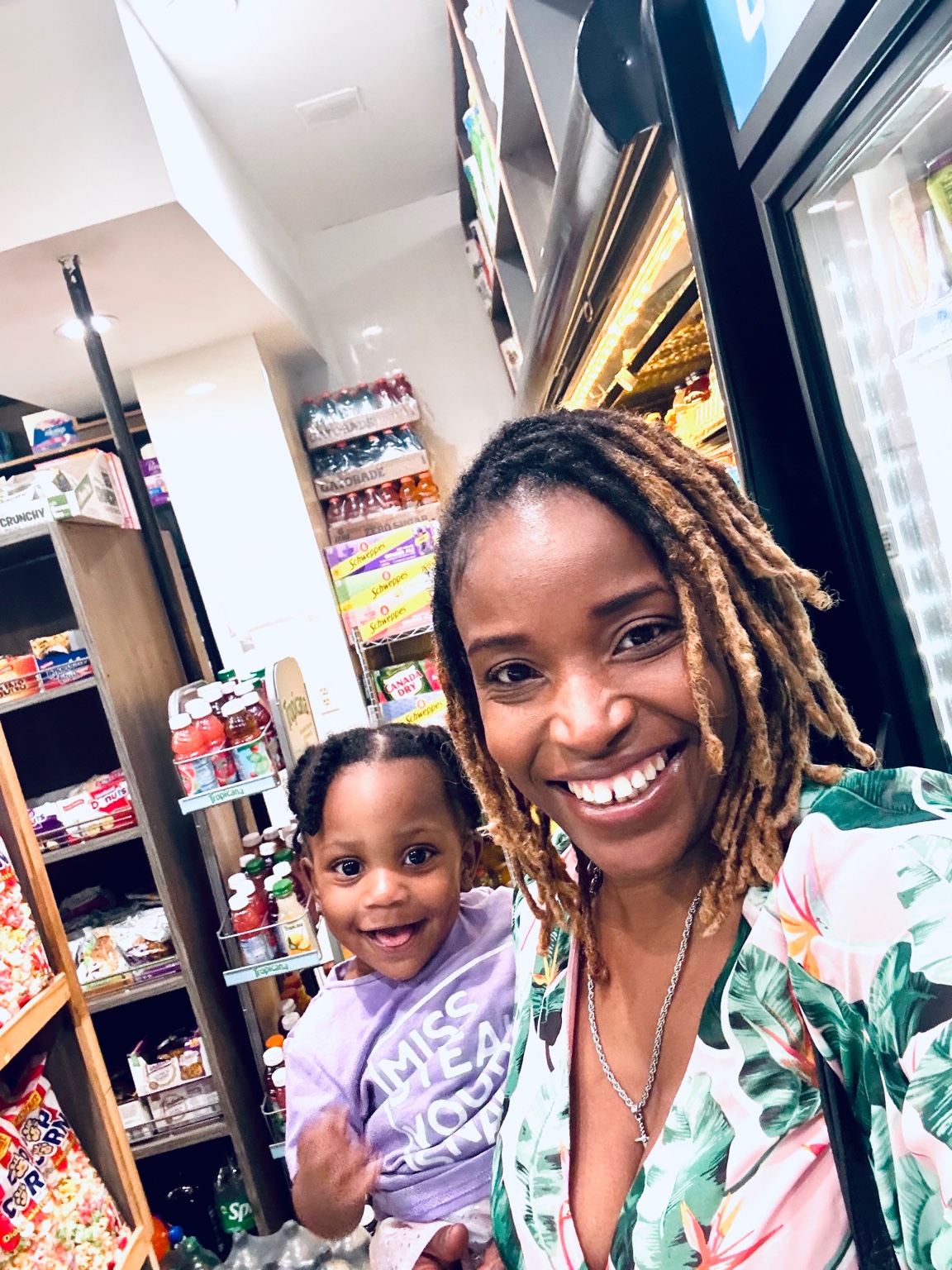 Valerie Duplan with her daughter — fine natural hair specialist and mother