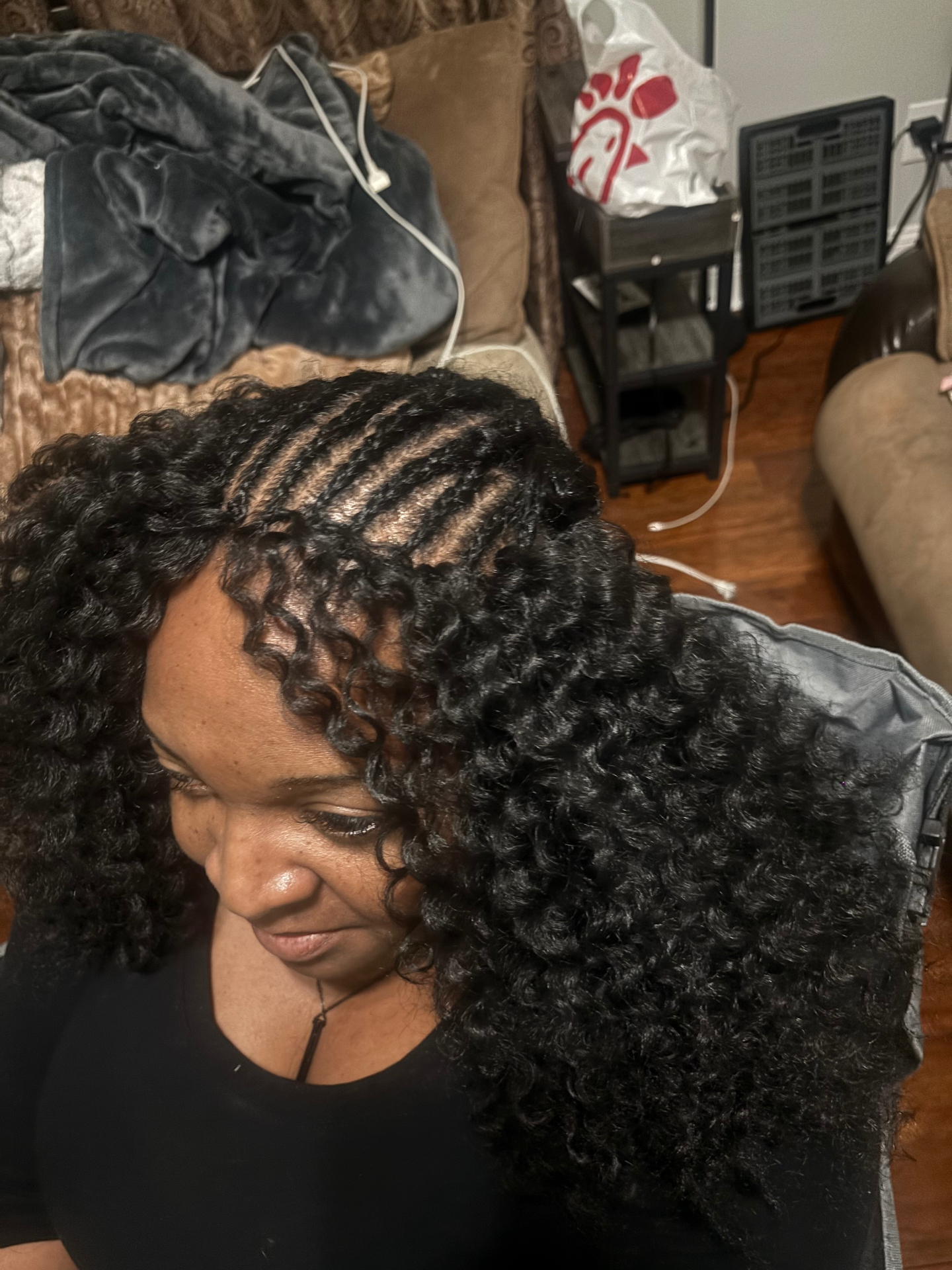 Full curly protective hairstyle with a neat braided foundation